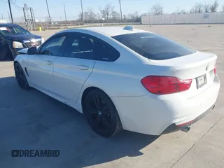2015 BMW 4 Series 435i with VIN WBA4B1C59FD955497, listed as a IAAI auction lot 41174096 with 101,047 mi miles and . Bid and sale history available at carsss.com. Image 3.