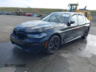 2023 BMW 5 Series 530e with VIN WBA13AG09PCL56556, listed as a IAAI auction lot 42098427 with Not provided miles and . Bid and sale history available at DreamBid. Image 2.