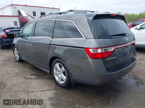 2013 Honda Odyssey Touring with VIN 5FNRL5H94DB013310, listed as a IAAI auction lot 42079565 with 128,622 mi miles and . Bid and sale history available at carsss.com. Image 3.