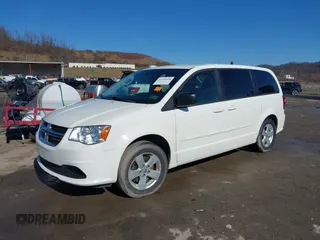 2013 Dodge Grand Caravan SE with VIN 2C4RDGBG0DR760598, listed as a IAAI auction lot 41590428 with 182,847 mi miles and . Bid and sale history available at DreamBid. Image 2.