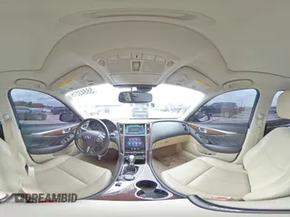 2014 Infiniti Q50 Premium with VIN JN1BV7AP4EM676758, listed as a Copart auction lot 58843275 with 138,404 mi miles and Salvage title. Bid and sale history available at DreamBid. Image 14.