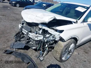 2015 Lincoln MKC with VIN 5LMTJ2AH8FUJ31911, listed as a IAAI auction lot 41735017 with 76,332 mi miles. Bid and sale history available at carsss.com. Image 6.