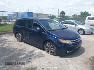 2015 Honda Odyssey Touring Elite with VIN 5FNRL5H96FB039538, listed as a IAAI auction lot 41877882 with 136,007 mi miles and . Bid and sale history available at DreamBid. Image 1.
