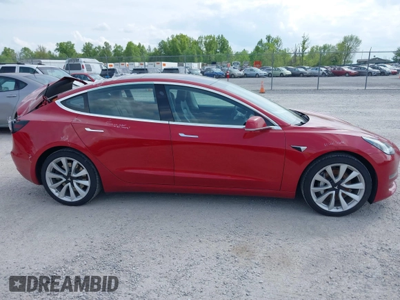 2018 Tesla Model 3 Long Range Battery with VIN 5YJ3E1EA8JF031683, listed as a IAAI auction lot 39275313 with 136,939 mi miles and . Bid and sale history available at DreamBid. Image 13.