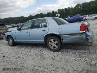 1999 Ford Crown Victoria LX with VIN 2FAFP74WXXX137154, listed as a Copart auction lot 71418784 with 97,589 mi miles and Salvage Title. Bid and sale history available at carsss.com. Image 2.