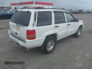 1998 Jeep Grand Cherokee Laredo with VIN 1J4GZ48S3WC204990, listed as a IAAI auction lot 41704176 with 185,376 mi miles. Bid and sale history available at carsss.com. Image 4.