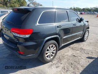 2014 Jeep Grand Cherokee Laredo with VIN 1C4RJEAG7EC263590, listed as a IAAI auction lot 41699106 with 136,581 mi miles and . Bid and sale history available at DreamBid. Image 4.