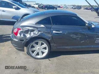 2005 Chrysler Crossfire Limited z VIN 1C3AN69L15X033940, wystawiony jako IAAI lot #41651049 z przebiegiem 88 450 mil mil oraz . Historia ofert i sprzedaży dostępna na DreamBid. Obrazek 6.