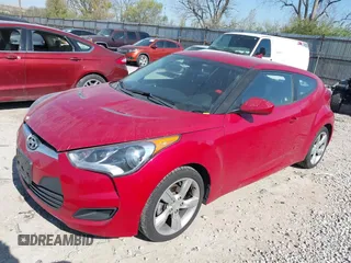 2014 Hyundai Veloster with VIN KMHTC6AD2EU214847, listed as a IAAI auction lot 42067728 with 77,421 mi miles. Bid and sale history available at carsss.com. Image 2.
