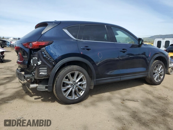 2021 Mazda CX-5 Grand Touring with VIN JM3KFBDM2M0494679, listed as a Copart auction lot 50017675 with 25,965 mi miles and Salvage Title. Bid and sale history available at carsss.com. Image 3.