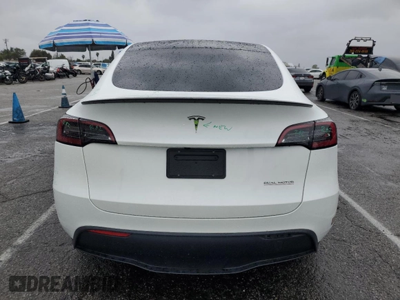 2023 Tesla Model Y Performance with VIN 7SAYGDEF1PF809654, listed as a Copart auction lot 43981915 with 16,401 mi miles and Salvage Title. Bid and sale history available at DreamBid. Image 6.