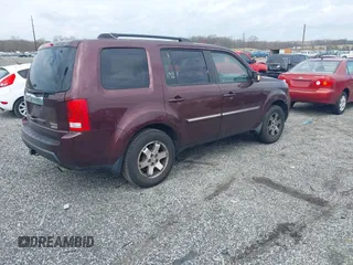 2010 Honda Pilot Touring with VIN 5FNYF4H95AB040721, listed as a IAAI auction lot 41928412 with 213,219 mi miles and . Bid and sale history available at carsss.com. Image 4.