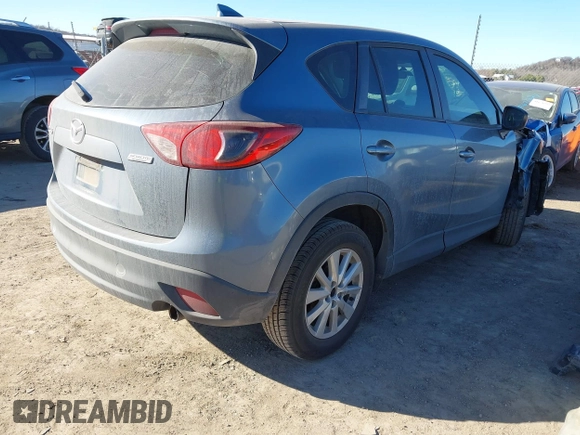 2016 Mazda CX-5 Sport with VIN JM3KE2BY3G0641895, listed as a IAAI auction lot 41689138 with 121,636 mi miles and . Bid and sale history available at DreamBid. Image 4.