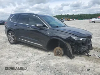 2020 Cadillac XT6 FWD Premium Luxury with VIN 1GYKPCRS9LZ205904, listed as a Copart auction lot 60575174 with 90,432 mi miles and Salvage Title. Bid and sale history available at carsss.com. Image 4.