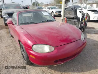 1999 Mazda MX-5 Miata z VIN JM1NB3531X0129508, wystawiony jako IAAI lot #41601347 z przebiegiem 156 702 mil mil oraz . Historia ofert i sprzedaży dostępna na DreamBid. Obrazek 1.