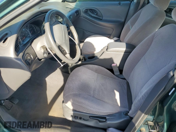 1999 Ford Taurus SE with VIN 1FAFP53U2XG184723, listed as a Copart auction lot 60787115 with 128,277 mi miles and Salvage title. Bid and sale history available at DreamBid. Image 7.