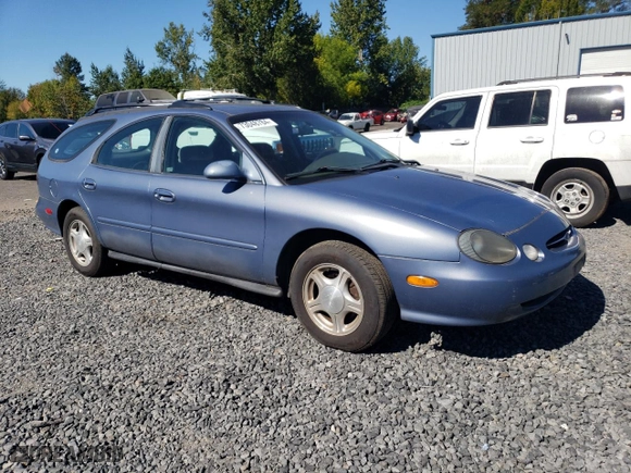 1999 Ford Taurus SE Standard with VIN 1FAFP58U9XG271897, listed as a Copart auction lot 73048784 with 190,518 mi miles and Salvage Title. Bid and sale history available at carsss.com. Image 4.