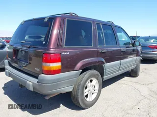 1996 Jeep Grand Cherokee Laredo with VIN 1J4GZ58S3TC391942, listed as a IAAI auction lot 41711778 with 202,765 mi miles. Bid and sale history available at carsss.com. Image 4.