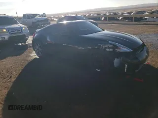 2014 Nissan 370Z Nismo z VIN JN1AZ4EHXEM632166, wystawiony jako Copart lot #88311915 z przebiegiem 18 414 mil mil oraz Szkoda całkowita • Salvage title. Historia ofert i sprzedaży dostępna na DreamBid. Obrazek 14.
