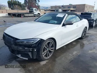2022 BMW 4 Series M440i with VIN WBA53AT02NCJ20674, listed as a IAAI auction lot 41200398 with 28,235 mi miles and . Bid and sale history available at DreamBid. Image 2.