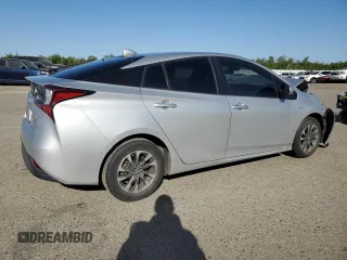 2020 Toyota Prius L Eco z VIN JTDKARFU1L3122471, wystawiony jako Copart lot #54164935 z przebiegiem 130 642 mil mil oraz Szkoda całkowita • Salvage title. Historia ofert i sprzedaży dostępna na DreamBid. Obrazek 3.