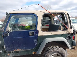 1997 Jeep Wrangler SE with VIN 1J4FY29PXVP406939, listed as a IAAI auction lot 41612380 with 248,314 mi miles. Bid and sale history available at carsss.com. Image 19.