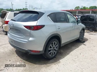 2018 Mazda CX-5 Grand Touring with VIN JM3KFADM6J0339185, listed as a IAAI auction lot 42160763 with 86,312 mi miles and . Bid and sale history available at DreamBid. Image 4.