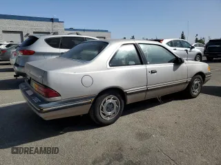 1989 Ford Tempo z VIN 1FAPP31X0KK113919, wystawiony jako Copart lot #76599314 z przebiegiem 65 823 mil mil oraz Tytuł czysty. Historia ofert i sprzedaży dostępna na DreamBid. Obrazek 3.