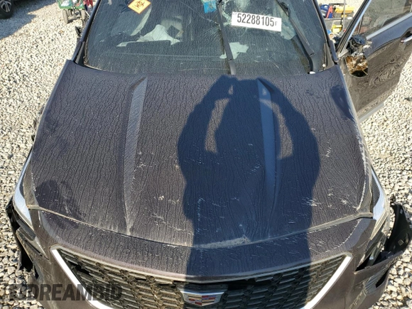 2021 Cadillac XT4 FWD Premium Luxury z VIN 1GYFZCR45MF002654, wystawiony jako Copart lot #52288105 z przebiegiem Nie podano mil oraz Szkody całkowita. Historia ofert i sprzedaży dostępna na DreamBid. Obrazek 13.