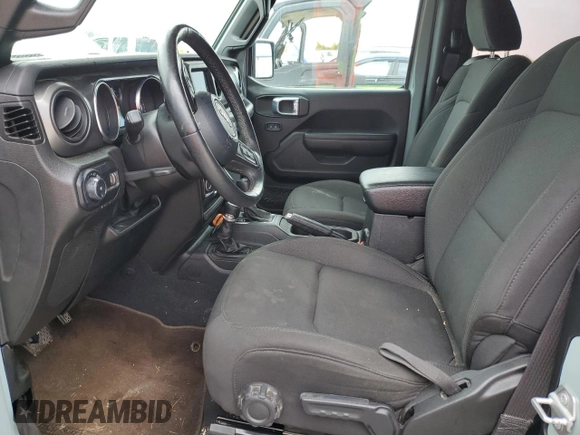 2023 Jeep Wrangler Sport with VIN 1C4HJXAG0PW595881, listed as a Copart auction lot 65590025 with 19,597 mi miles and Salvage title. Bid and sale history available at DreamBid. Image 7.