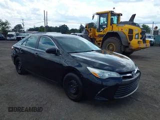 2015 Toyota Camry LE z VIN 4T1BD1FK7FU164676, wystawiony jako IAAI lot #42572267 z przebiegiem 399 510 mil mil oraz . Historia ofert i sprzedaży dostępna na DreamBid. Obrazek 1.