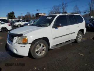 2002 GMC Envoy SLT z VIN 1GKDS13S322239911, wystawiony jako Copart lot #42486375 z przebiegiem 173 803 mil mil oraz Nie do naprawy • Non repairable. Historia ofert i sprzedaży dostępna na DreamBid. Obrazek 1.