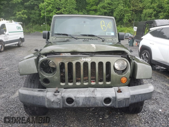 2007 Jeep Wrangler Unlimited Sahara с VIN 1J4GA59107L141710, выставлен на аукционе Copart как лот 59939755 с пробегом 212 659 миль миль и Списание • Salvage title. История ставок и продаж доступна на DreamBid. Изображение 5.