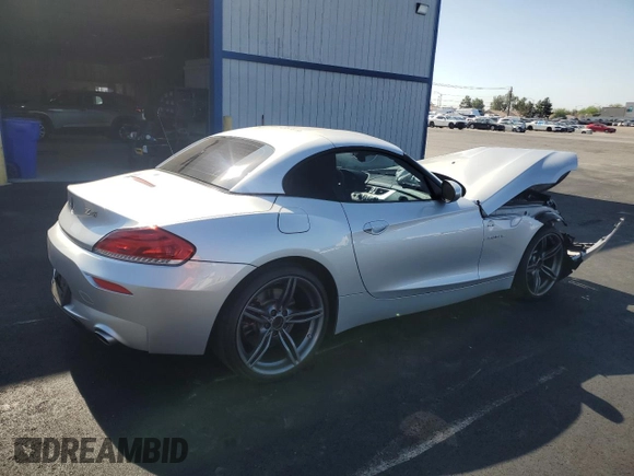 2011 BMW Z4 sDrive35is with VIN WBALM1C54BE633439, listed as a Copart auction lot 60327265 with 112,302 mi miles and Salvage title. Bid and sale history available at DreamBid. Image 3.