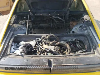 1986 Pontiac Fiero z VIN 1G2PG9796GP256622, wystawiony jako Copart lot #69203894 z przebiegiem 38 964 mil mil oraz Szkody całkowita. Historia ofert i sprzedaży dostępna na DreamBid. Obrazek 11.