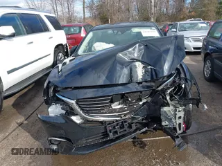 2016 Mazda 6 i Grand Touring with VIN JM1GJ1W54G1454115, listed as a IAAI auction lot 41203298 with 104,632 mi miles and . Bid and sale history available at DreamBid. Image 13.
