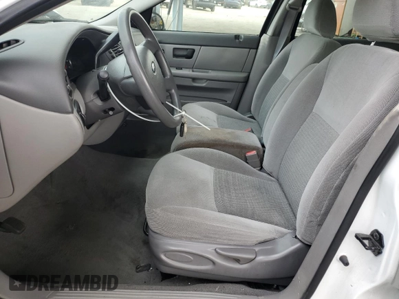 2006 Ford Taurus SE with VIN 1FAHP53U86A237001, listed as a Copart auction lot 62858785 with 133,697 mi miles and Salvage title. Bid and sale history available at DreamBid. Image 7.