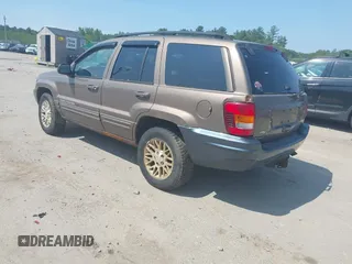 2002 Jeep Grand Cherokee Limited z VIN 1J8GW58N62C213751, wystawiony jako IAAI lot #42478869 z przebiegiem 233 848 mil mil oraz . Historia ofert i sprzedaży dostępna na DreamBid. Obrazek 3.