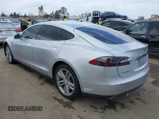 2013 Tesla Model S with VIN 5YJSA1DG7DFP11382, listed as a IAAI auction lot 42056169 with 126,975 mi miles. Bid and sale history available at carsss.com. Image 3.