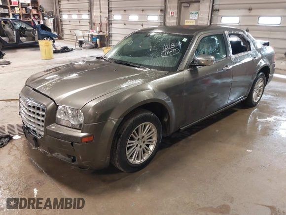 2010 Chrysler 300 Touring with VIN 2C3CA5CV9AH101800, listed as a IAAI auction lot 42015640 with 128,457 mi miles and . Bid and sale history available at DreamBid. Image 2.