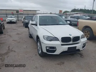 2014 BMW X6 xDrive35i with VIN 5UXFG2C51E0K41628, listed as a IAAI auction lot 41966965 with 125,576 mi miles. Bid and sale history available at carsss.com. Image 1.
