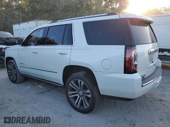 2019 GMC Yukon Denali with VIN 1GKS1CKJ8KR353280, listed as a Copart auction lot 77316454 with 74,476 mi miles and Salvage Title. Bid and sale history available at carsss.com. Image 2.
