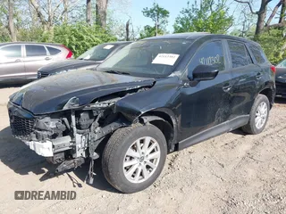 2014 Mazda CX-5 Touring z VIN JM3KE4CY4E0328880, wystawiony jako IAAI lot #42112302 z przebiegiem 185 228 mil mil oraz . Historia ofert i sprzedaży dostępna na DreamBid. Obrazek 6.