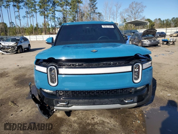 2022 Rivian R1T Launch Edition z VIN 7FCTGAAL7NN000539, wystawiony jako Copart lot #87811245 z przebiegiem Nie podano mil oraz Szkody całkowita. Historia ofert i sprzedaży dostępna na DreamBid. Obrazek 5.