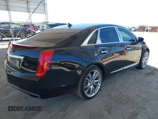 2013 Cadillac XTS Premium z VIN 2G61S5S36D9128244, wystawiony jako IAAI lot #41976485 z przebiegiem 88 033 mil mil oraz . Historia ofert i sprzedaży dostępna na DreamBid. Obrazek 4.
