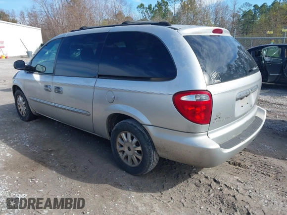 2003 Chrysler Town & Country LX with VIN 2C4GP44L03R203678, listed as a IAAI auction lot 41293296 with 210,827 mi miles and . Bid and sale history available at DreamBid. Image 3.