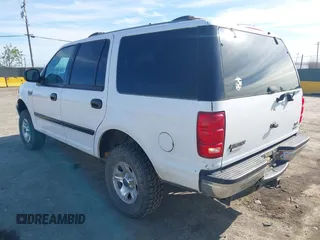 1999 Ford Expedition XLT z VIN 1FMPU18L0XLB52467, wystawiony jako IAAI lot #42018037 z przebiegiem 288 327 mil mil oraz . Historia ofert i sprzedaży dostępna na DreamBid. Obrazek 3.