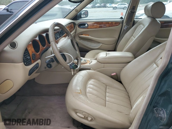 1999 Jaguar XJ with VIN SAJHX1044XC865054, listed as a Copart auction lot 57825325 with 71,145 mi miles and Clean title. Bid and sale history available at DreamBid. Image 7.
