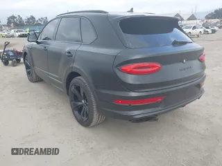 2021 Bentley Bentayga V8 z VIN SJAAM2ZV5MC038171, wystawiony jako IAAI lot #42057762 z przebiegiem 25 973 mil mil oraz . Historia ofert i sprzedaży dostępna na DreamBid. Obrazek 3.