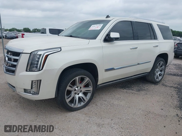 2015 Cadillac Escalade Premium z VIN 1GYS4CKJ4FR216873, wystawiony jako IAAI lot #41677234 z przebiegiem 128 990 mil mil oraz . Historia ofert i sprzedaży dostępna na DreamBid. Obrazek 2.